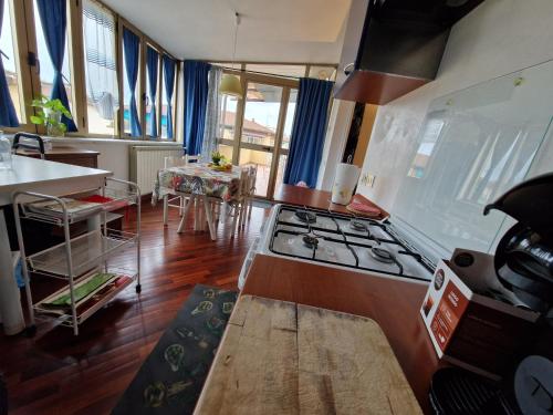a kitchen with a stove top oven in a room at Trilly's House is waiting for you! Panoramic Penthouse in Florence