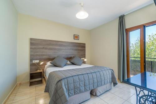 Ένα ή περισσότερα κρεβάτια σε δωμάτιο στο Hotel Montmar