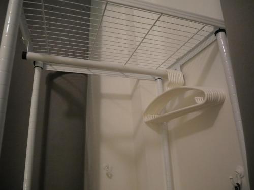 a shower with a white shower curtain and a shower head at Cozy at Kohlarn in Ko Larn