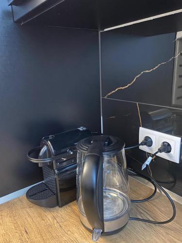 a desk with a glass blender and a telephone at Vienna Luxury Dream Home in Vienna