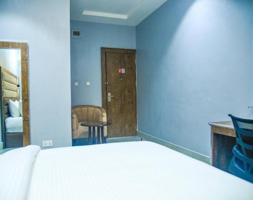 Ein Bett oder Betten in einem Zimmer der Unterkunft Le Mehol Hotel and Suites
