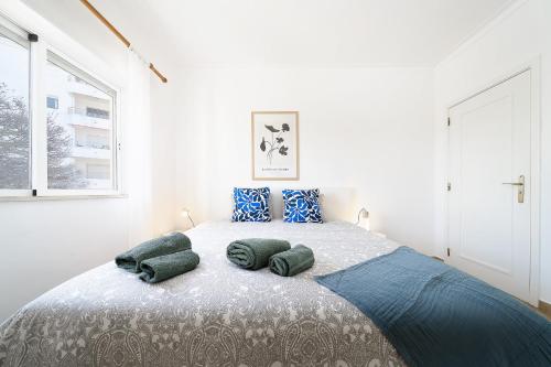 a bedroom with a large bed with pillows on it at Casa Rapp in Alvor