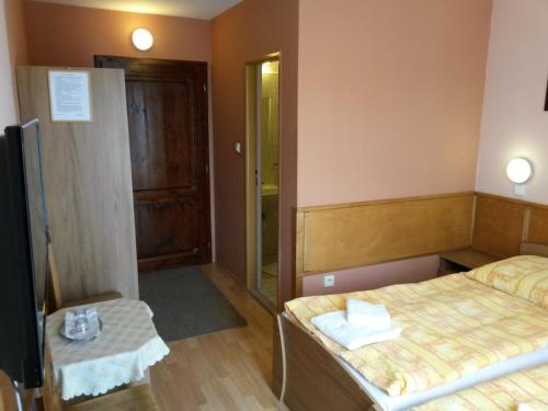 Postel nebo postele na pokoji v ubytování Pension Magnolia