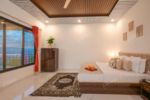 a bedroom with a bed and a large window at Lifeline Villas - Wonderment Luxurious Valley View 5Bhk Villa in Mahabaleshwar