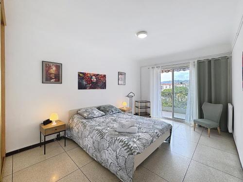 Ένα ή περισσότερα κρεβάτια σε δωμάτιο στο L'Escapade Méditerranéenne Juan