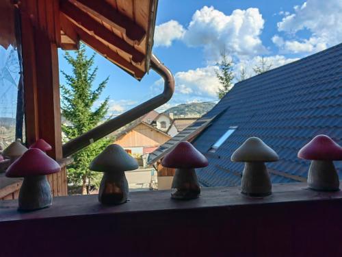a group of five mushrooms sitting on a window sill at Casa bunicilor dor de Bucovina in Câmpulung Moldovenesc