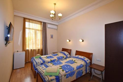 Ένα ή περισσότερα κρεβάτια σε δωμάτιο στο Villa Rosa