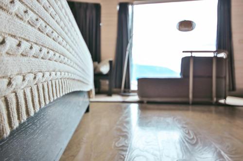 a close up of a bed in a living room at Dali Shuanglang seven-room sea view hotel in Dali Shuanglang