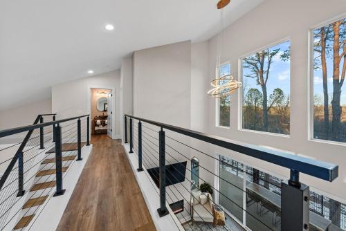 a staircase in a house with windows at Adamina Canyon Luxurious, Canyon View 5BR, 3BTH 1 in Rockbridge