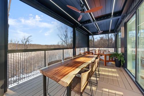 a large deck with a wooden table and chairs at Adamina Canyon Luxurious, Canyon View 5BR, 3BTH 1 in Rockbridge