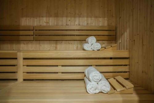 a sauna with two towels sitting on the shelves at Noli Gdansk Wrzeszcz in Gdańsk
