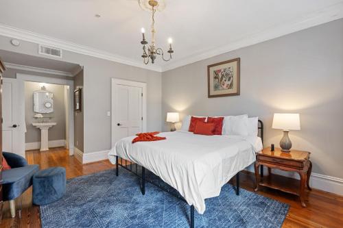 a bedroom with a large bed and a blue rug at Walk To Bars Shopping River Street!-3 in Savannah
