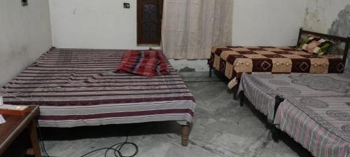 Postel nebo postele na pokoji v ubytování Nitin tyagi homestay