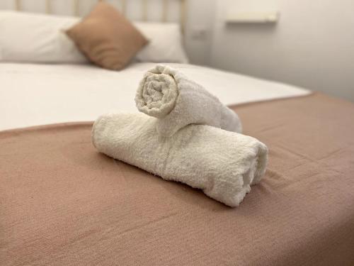 Postel nebo postele na pokoji v ubytování Precioso apto cerca del Puente del Dragón