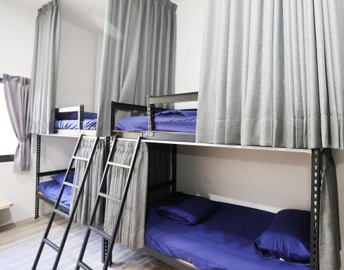戀海輕旅Ocean Pride Hostelにあるベッド