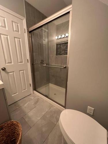 a glass shower in a bathroom with a toilet at 5Guest House Baltimore County(own room, Joppa RD) in Parkville