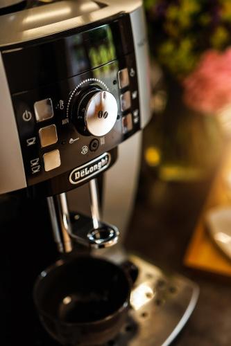 a coffeemaker on a counter with a bowl at Apartmán Ranč in Martin