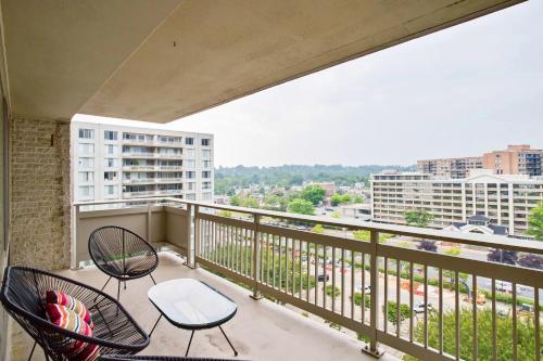 a balcony with two chairs and a table at Family-Sized 3BR Retreat Minutes from Reagan National in Arlington