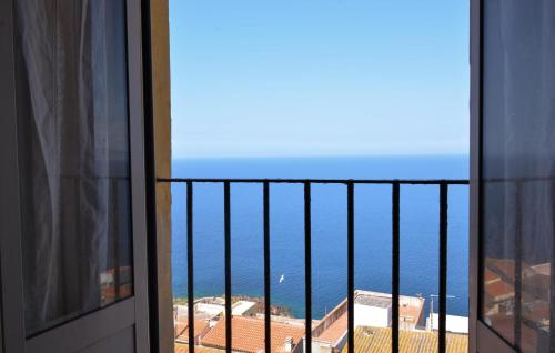 a view of the ocean from a balcony at 3 Bedroom Gorgeous Apartment In Castelsardo in Castelsardo