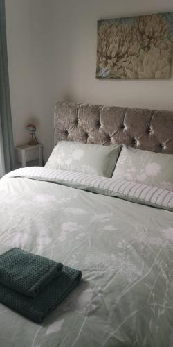 a close up of a bed with a pillow on it at 39 Cowley Road in Liverpool