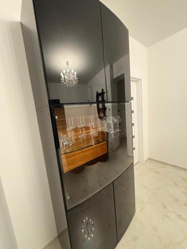 a room with a glass wall with a table in it at Vienna Luxury Dream Home in Vienna