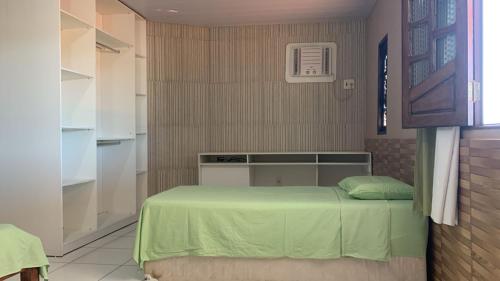 Ένα ή περισσότερα κρεβάτια σε δωμάτιο στο Casa temporada Praia do Frances