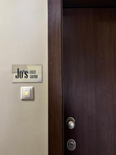 a door with a sign that reads jobs cry center at Jo's cozy corner in Volos