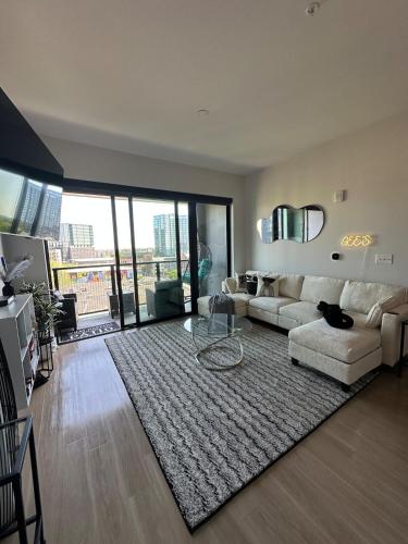 a living room with a couch and a rug at Giaviana's in Atlanta