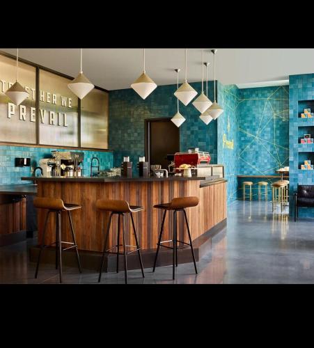 a kitchen with a bar with stools at a counter at Giaviana's in Atlanta