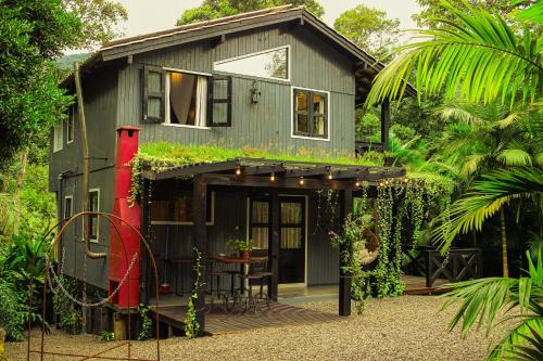 Taman di luar Aconchego dos Pássaros