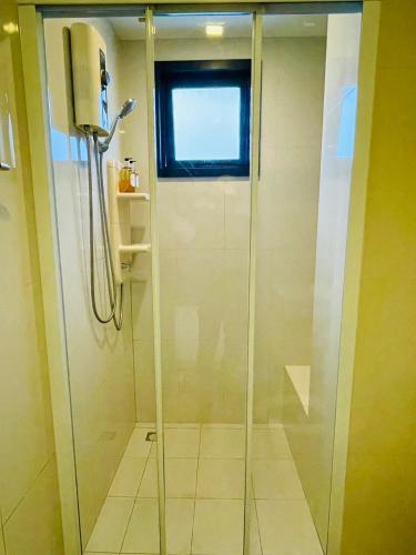 a shower with a glass door in a bathroom at The base Central 2 bed 1 bath 514 by Numam in Pattaya
