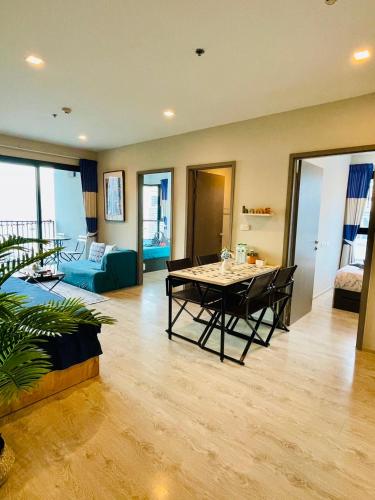 a living room with a table and a couch at The base Central 2 bed 1 bath 514 by Numam in Pattaya