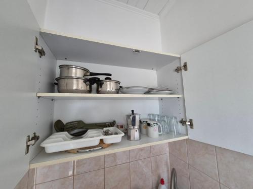 Kuchyň nebo kuchyňský kout v ubytování Roxanna Apartman