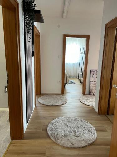 a hallway with three rugs on the floor of a house at Ferienwohnung Ferlach TOP1 in Ferlach