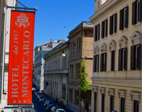 an orange sign on the side of a street at Hotel Montecarlo in Rome