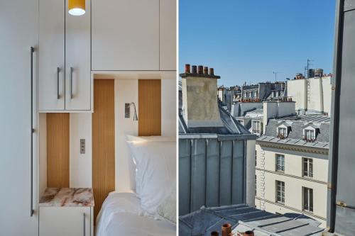 Cette chambre comprend un lit et offre une vue sur la ville. dans l'établissement SaintGermainByCecile - Luxueux 2 pièces AC Bianca, à Paris
