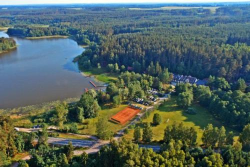an aerial view of a park next to a lake at Ośrodek Wypoczynkowy Kołatek in Olsztynek