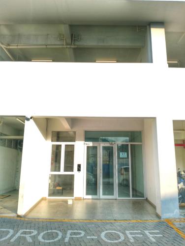 an entrance to a building with two glass doors at Maldives City 1 in Male City