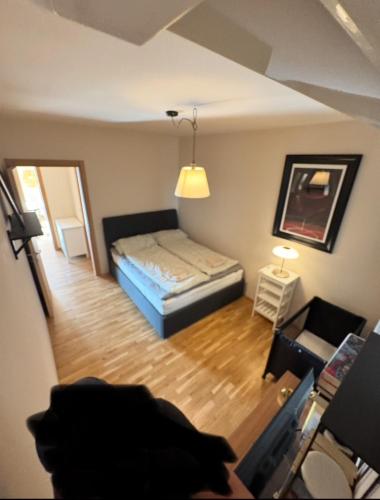 a small bedroom with a bed and a living room at Casa Panzano Tuscany in Panzano
