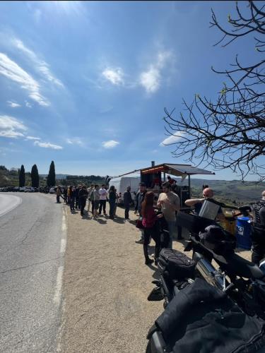 a group of people standing on the side of a road at Casa Panzano Tuscany in Panzano