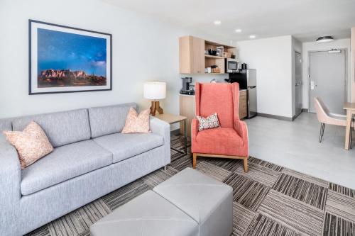a living room with a couch and a chair at Hilton Garden Inn Albuquerque Uptown in Albuquerque