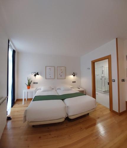 Postel nebo postele na pokoji v ubytování Hotel Nochendi