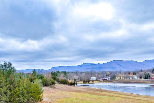 a view of a river with mountains in the background at Lakeside Catskills Escape - Soak, Sip, Stargaze in Cairo