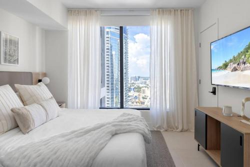 מיטה או מיטות בחדר ב-3209 Apt in Heart of Downtown with Pool a Gym and Spa