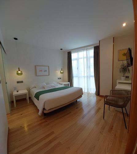 Postel nebo postele na pokoji v ubytování Hotel Nochendi