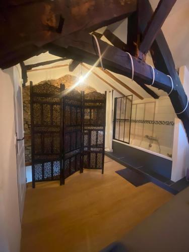a view of a room with a iron gate at Gîte de la source in Sainte-Marie-de-Vaux