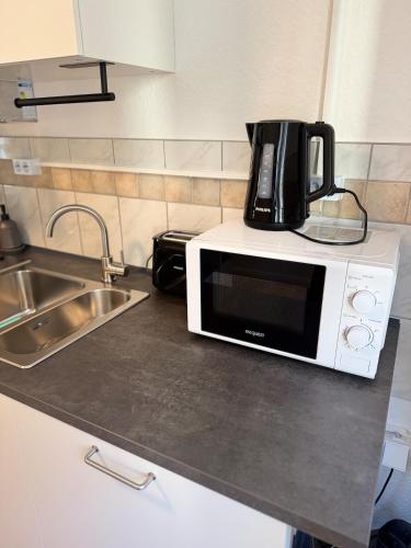 Η κουζίνα ή μικρή κουζίνα στο Modernes Apartment Offenbach, nähe Frankfurt Messe