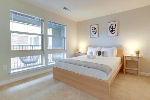 a bedroom with a large bed and a large window at Spacious Stay in Alexandria Easy Access to DC in Alexandria