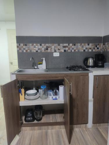 a kitchen with a sink and a counter at Aparta Estudio Valle del Lili- Cali canto in Cali
