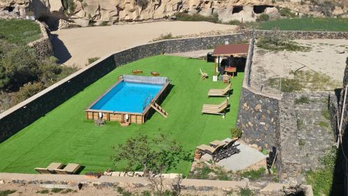 an aerial view of a house with a swimming pool at Casa Rural Anton Piche with Pool-Adults Only in Granadilla de Abona